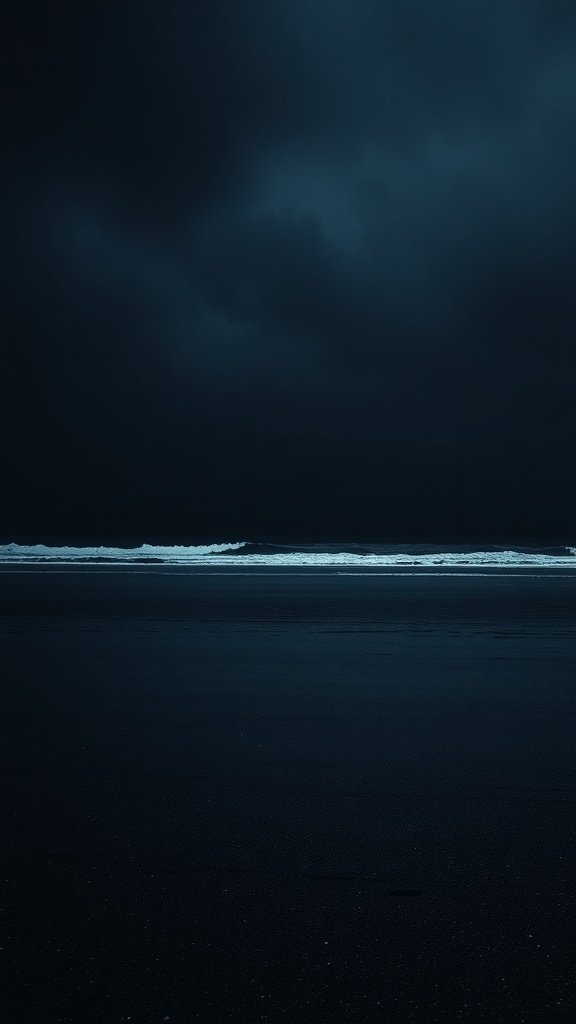 50 Stunning Black Wallpapers for a Chic Look A dark beach with black sand and waves under a cloudy sky.