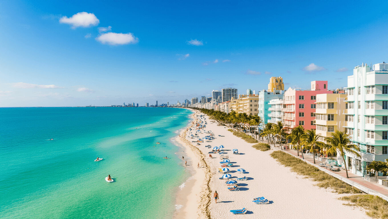 "Aerial view of South Beach Miami in March, featuring pastel Art Deco buildings, beach umbrellas, loungers, paddleboarders, jet skiers, palm trees, the Versace Mansion, and the South Pointe Park pier in early spring sunlight."