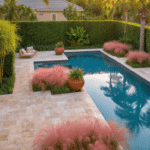 Cinematic aerial view of a Florida pool landscape at golden hour, showcasing travertine pavers, lush Podocarpus hedges, Pygmy Date Palms, pink Muhly grass, and warm stone textures, with a crystal blue pool, dappled sunlight, and vibrant coral Bougainvillea blooms.